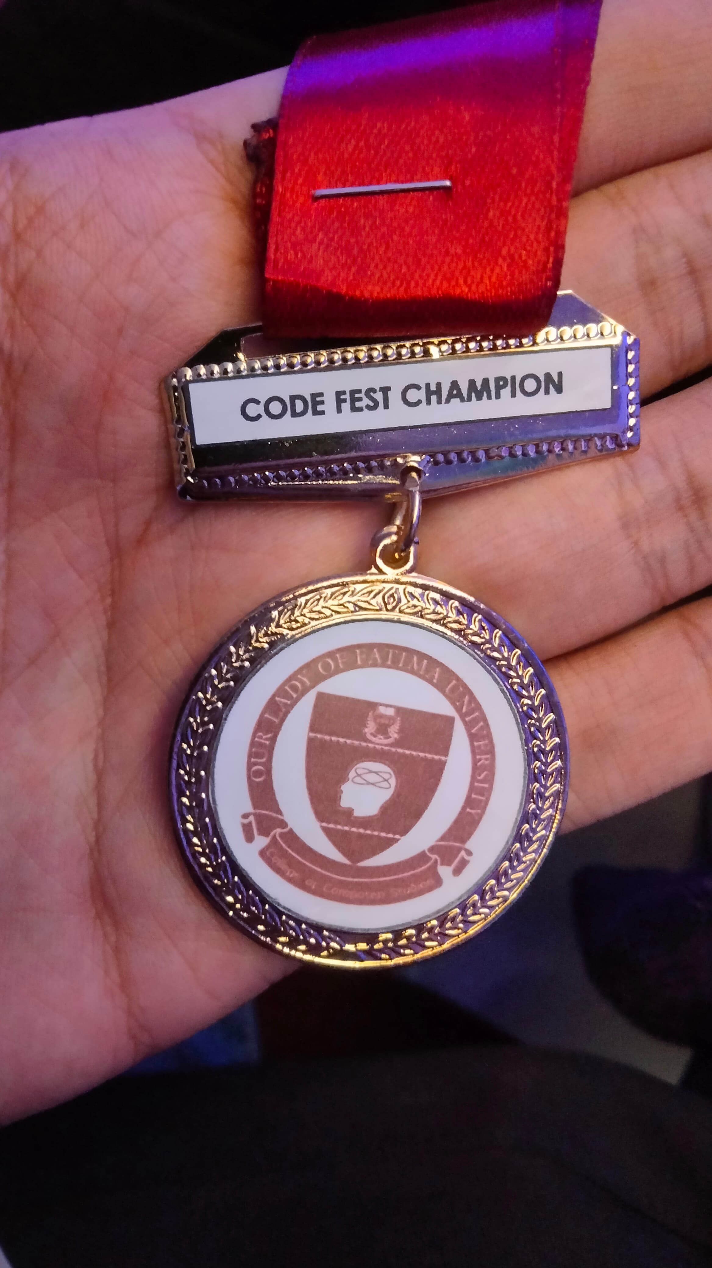 Champion medal awarded to Joaquin Valdez for winning Web Development competition at CCS Week 2023 at Our Lady of Fatima University Quezon City Campus